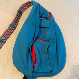 Blue and orange-coral Kavu sling bag